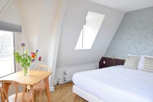 Voodi või voodid majutusasutuse Hotel Sebel toas