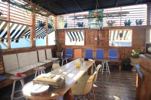 a dining room with a wooden table and chairs at The Cabin in Amman