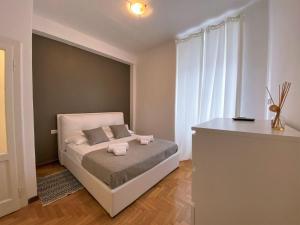 Posteľ alebo postele v izbe v ubytovaní Via Benzi Apartment Como