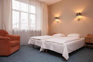 Postel nebo postele na pokoji v ubytování Guesthouse Jakob Lenz