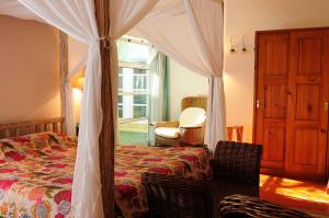 Ένα ή περισσότερα κρεβάτια σε δωμάτιο στο Casa Do Foral