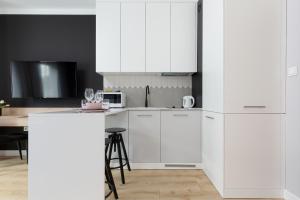 Kuchyňa alebo kuchynka v ubytovaní Apartments Warsaw Pawia by Noclegi Renters