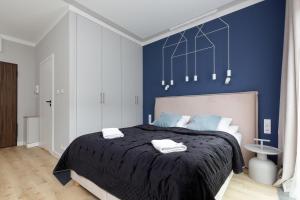 Posteľ alebo postele v izbe v ubytovaní Apartments Warsaw Pawia by Noclegi Renters