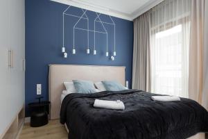 Posteľ alebo postele v izbe v ubytovaní Apartments Warsaw Pawia by Noclegi Renters