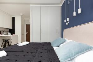 Posteľ alebo postele v izbe v ubytovaní Apartments Warsaw Pawia by Noclegi Renters