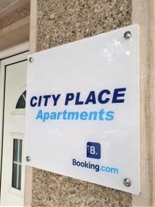 a sign that reads city place apartments on a building at City Place Apartments in Kumanovo