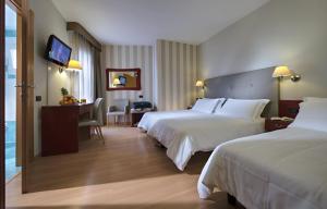 Postel nebo postele na pokoji v ubytování Hotel Orient & Pacific