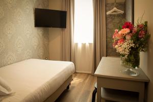 TV a/nebo společenská místnost v ubytování Hotel Della Rosa