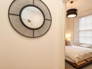a bedroom with a large mirror on the wall at Mount Sion in Royal Tunbridge Wells