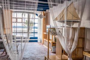 Postel nebo postele na pokoji v ubytování La casa de las barcas Suite a pie de playa
