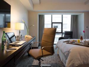 Letto o letti in una camera di Swissotel Lima