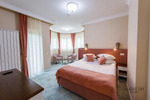 Postel nebo postele na pokoji v ubytování Moviliţa Residence