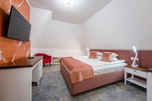 Postel nebo postele na pokoji v ubytování Moviliţa Residence