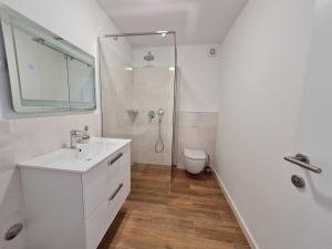 Kúpeľňa v ubytovaní Apartmani Adria