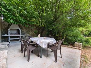 a table and chairs sitting on a patio at House Krnica 2120 in Krnica +12 photos