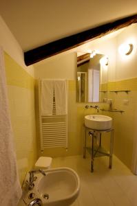 a bathroom with a sink and a mirror at La Casa di Donn'Amelia in Vietri sul Mare