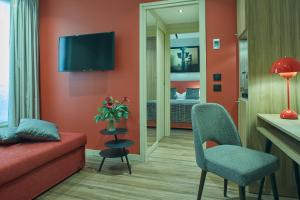 TV a/nebo společenská místnost v ubytování Hotel Atmospheres