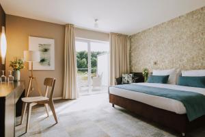 Postel nebo postele na pokoji v ubytování Hotel Terme Sveti Martin + 37 fotografií