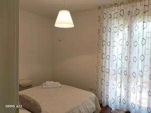 Postel nebo postele na pokoji v ubytování L'OLIVO appartamento turistico + 7 fotografií