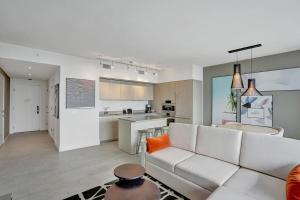 A kitchen or kitchenette at Amazing Apartments at H Beach House