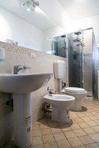 a bathroom with a sink and a toilet at Monolocale il Tindaro in Catania