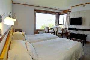 Postel nebo postele na pokoji v ubytování Hotel Elun, la mejor vista