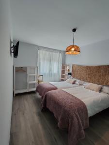 Postel nebo postele na pokoji v ubytování Casa Luis