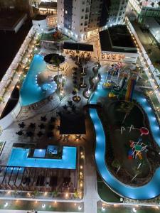 a view of a resort pool at night at Salinas Exclusive Resort 2/4 até 7 pessoas in Salinópolis