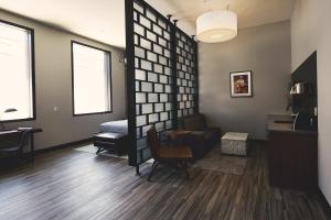 a living room with a couch and a chair at Hotel Vandivort in Springfield +77 photos