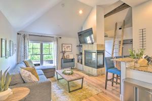 a living room with a couch and a fireplace at 5 Mi to Ski Resort: Breck Penthouse Studio in Breckenridge