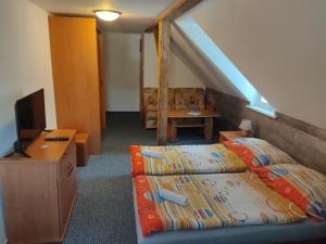 Postel nebo postele na pokoji v ubytování Pension Horalka 206