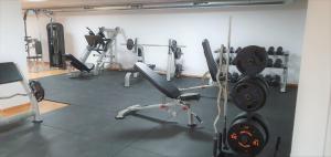 a gym with several exercise equipment in a room at La envia golf in Vícar