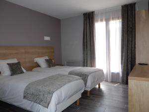 Postel nebo postele na pokoji v ubytování Hotel Marinet
