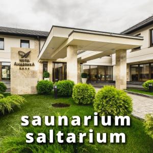 a building with the words saarinen saarinen saladin at Hotel Amazonka Conference and Spa in Ciechocinek