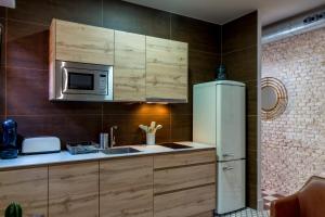 A kitchen or kitchenette at Doña Elvira Suites Cathedral