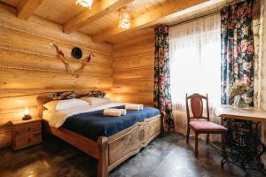 Tempat tidur dalam kamar di NA BALI po góralsku