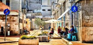 a group of people walking down a city street at Via Pisa 20 Mansarda in Bari