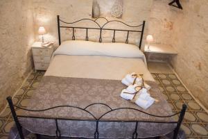 Postel nebo postele na pokoji v ubytování Trullo Sweet Trullo