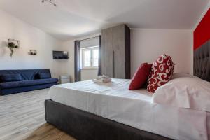 Postel nebo postele na pokoji v ubytování Cadoni Guest House