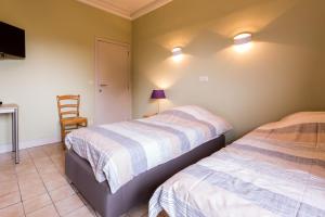 Postel nebo postele na pokoji v ubytování Arconaty Hotel