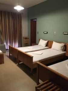 A bed or beds in a room at Artemis