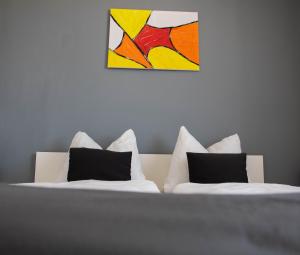 Posteľ alebo postele v izbe v ubytovaní Koller Apartmanház