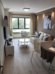 a living room with a couch and a table at Casa City in Arrecife