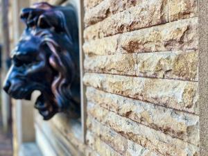 a gargoyle on the side of a brick wall at Casablanca in Adler