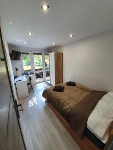 Ένα ή περισσότερα κρεβάτια σε δωμάτιο στο M&K Center Apartment +13 φωτογραφίες