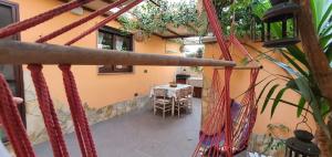 a balcony of a house with a table and chairs at Casa Tizy in Botrugno