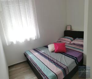 Postel nebo postele na pokoji v ubytování Apartmani Katarina
