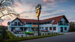 a fast food restaurant with a sign in front of it at Motel Eldorado in Mikulov