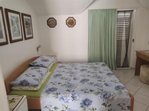 Postel nebo postele na pokoji v ubytování Villa Rosa