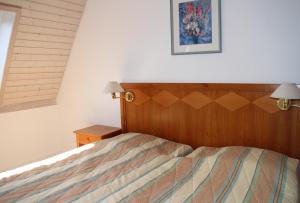 Postel nebo postele na pokoji v ubytování Résidences du Chamossaire